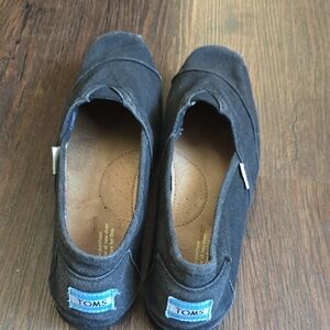 Toms Slip-On Sneakers in Black with Blue Logo Tabs